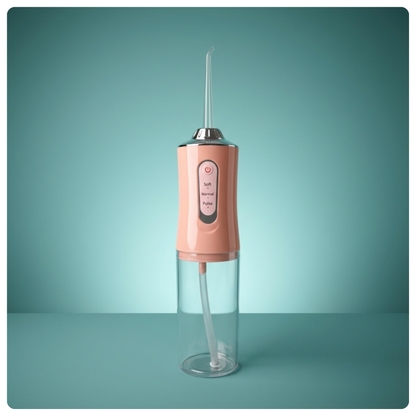 colour:pink Pink Avelora Pro water flosser on a teal background
