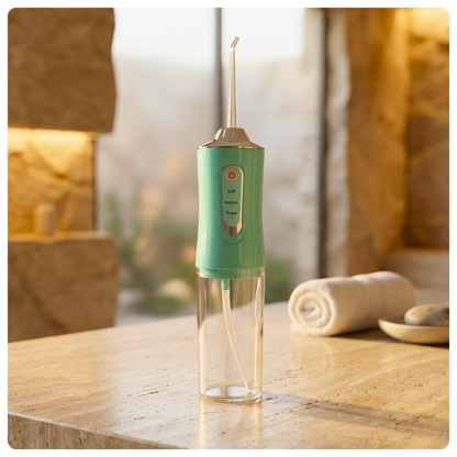 colour:green Green Avelora Pro water flosser in a modern stone bathroom