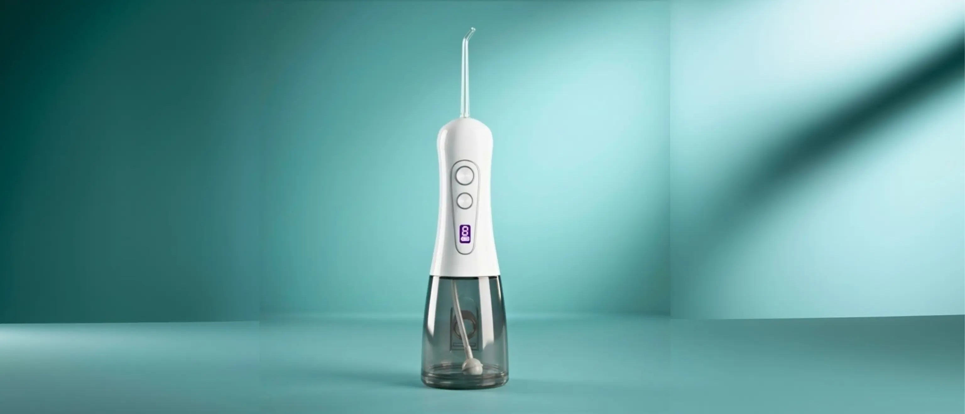 White Avelora Apex water flosser front profile on a teal background with studio lighting.